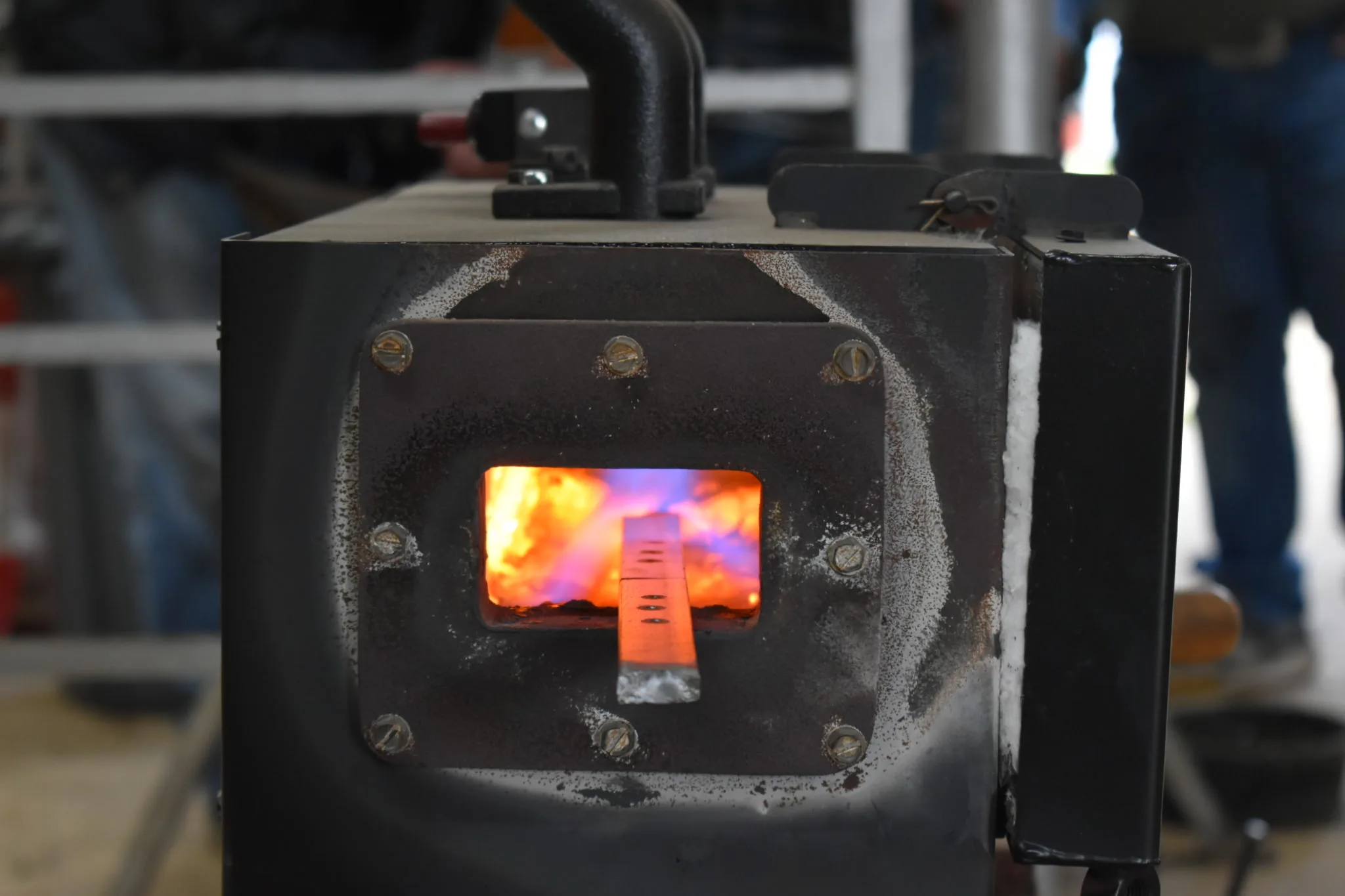 Forge fire with hot steel bar